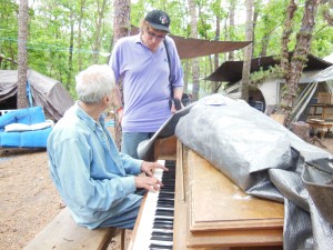 with Michael as he wondrously plays the piano in front of his tent.