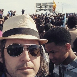 Arlan in Selma with Edmund Pettus Bridge in background